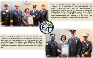 East Windsor Firefighters being honored with an award.